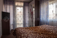 Гостевой дом "Лабиринт": Двухкомнатный номер, спальная комната, ТВ, шкаф, выход на балкон